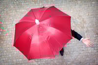 hand and red umbrella